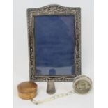 A HM silver photograph frame having repousse sways and bow design, hallmarked Birmingham 1917,