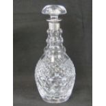 A cut glass decanter having HM silver collar and complete with stopper, hallmarked London 1969,