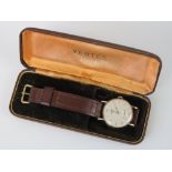 A vintage 9ct gold Vertex Review wrist watch having yellow metal batons, Arabic numerals and hands,