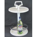 A 1970s Dutch white plastic portable drinks stand with tray top,