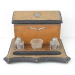 A late Victorian desk tray or standish complete with boxed letter rack, inkwells and pen recess,