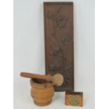 A vintage treen vesta case with inset brass cartouche, a fruitwood pestle and mortar,