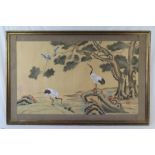 A modern Chinese painting on silk of a river landscape with storks and other birds,