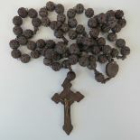 A large vintage carved set of rosary beads, complete with crucifix.