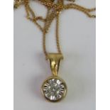 A solitaire diamond pendant, round cut brilliant diamond in illusion setting,