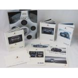 Three Porsche range books for the Precision 911, The 911, and Cayenne,