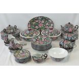 An extensive modern Chinese porcelain dinner and tea service in multicoloured canton enamels on a
