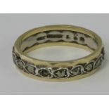 A silver and 9ct gold eternity ring,