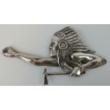 A rare cast metal Native American 'Indian' Cheif with tomohawk vehicle mascot in relief,