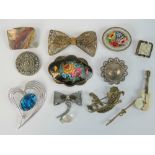 A quantity of assorted 20th century brooches including a floral handpainted Russian brooch,
