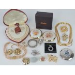 A small quantity of costume jewellery including a boxed suite of Rosita pearls, scarf clips,