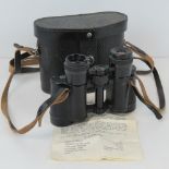 A pair of USSR made binoculars, 8x30, with case and carry straps.