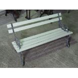 To match above lot. A contemporary childs iron framed slatted garden bench.