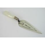 A delightful HM silver bookmark in the form of a trowel with mother of pearl handle,