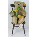 A Steiff 'Autumn' Teddy bear, seated on a chair, 41cm high.