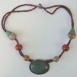 A handmade hardstone necklace, central w