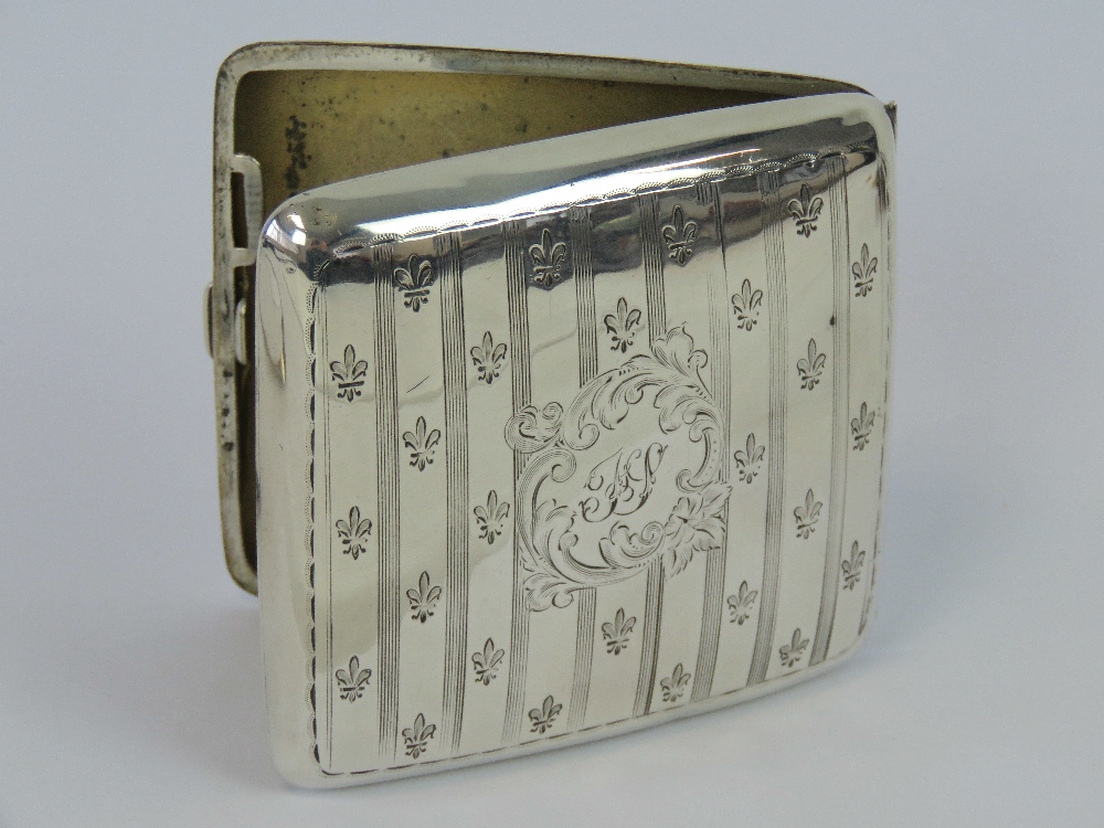 A HM silver cigarette case having fleur-