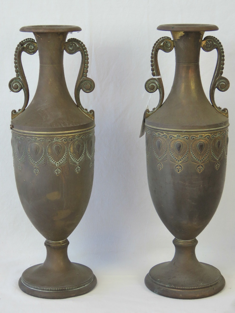 A pair of 20th century brass vases of Ro