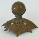 A brass ball finial from a Victorian pith helmet.