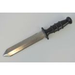 A Royal Navy Divers knife having saw back and rubberised grip, stamped NSN 64220 99 523 9744,