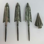 Four bronze arrow heads.