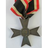 A WWII German War Merit Cross 1939 medal with original ribbon.