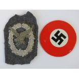 A WWII Luftwaffe Air Gunners cloth badge, together with a mirror having swastika design to back.