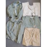 Two British Military Tropic uniform tops, two pairs of tropic uniform trousers and a pair of shorts.