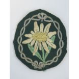 A WWII German Wehrmacht Mountain Troops Edelweiss cloth badge.