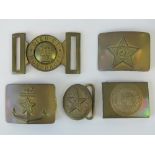 Five brass military buckles; three Russian, one German and one British.
