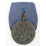 An SS 4 year Long Service medal, bearing legend 'Furer Ture Dinst Inder' before the number 4, 3.