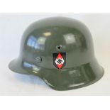 A reproduction WWII German helmet having leather liner.