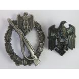 A reproduction WWII German Infantry Assault badge with Wehrmacht eagle badge.