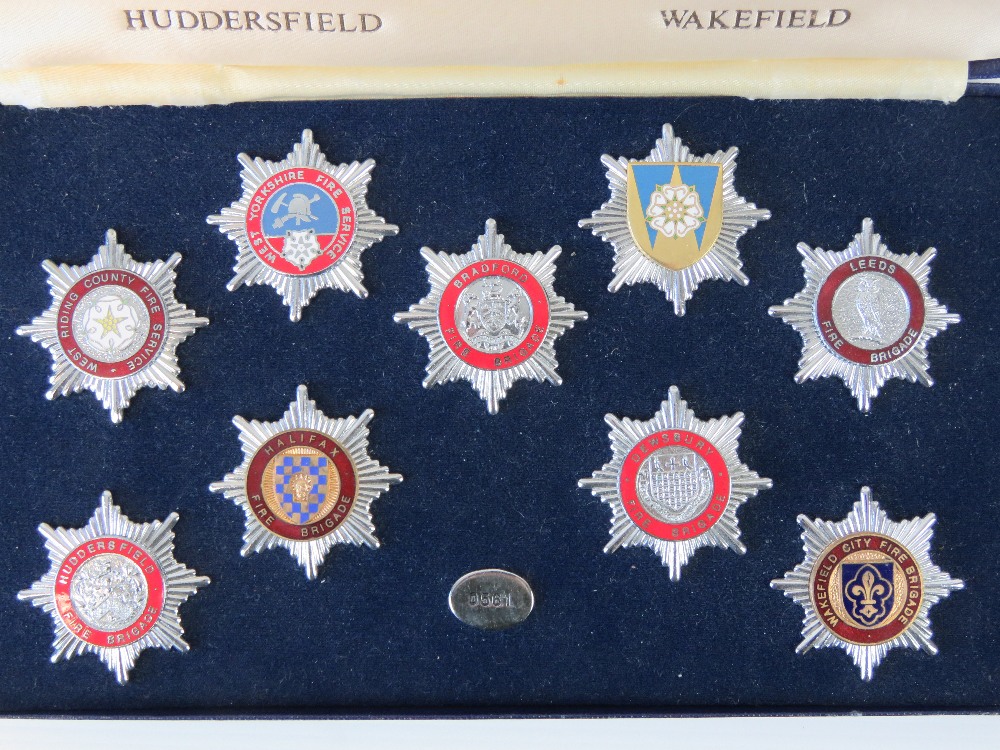 A limited edition set of West Yorkshire Fire Service cap badges, - Image 2 of 3