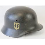 A WWII German SS helmet, having two decals upon,