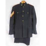 A WWII British Royal Artillery Officers dress tunic with original Sargent stripes and Flaming Bomb