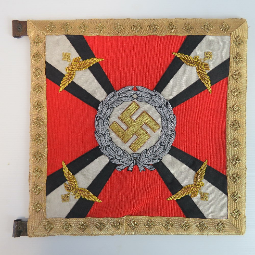 A reproduction WWII German Luftwaffe Officers car pennant with gilt thread embroidery to both sides.