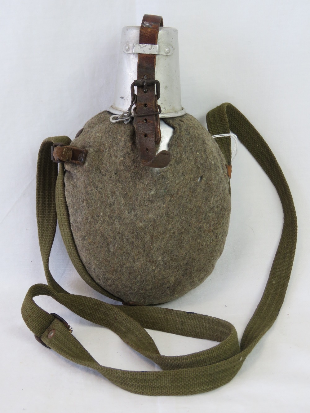 A WWII German Wehrmacht issue water bottle with aluminium cup and felt cover,