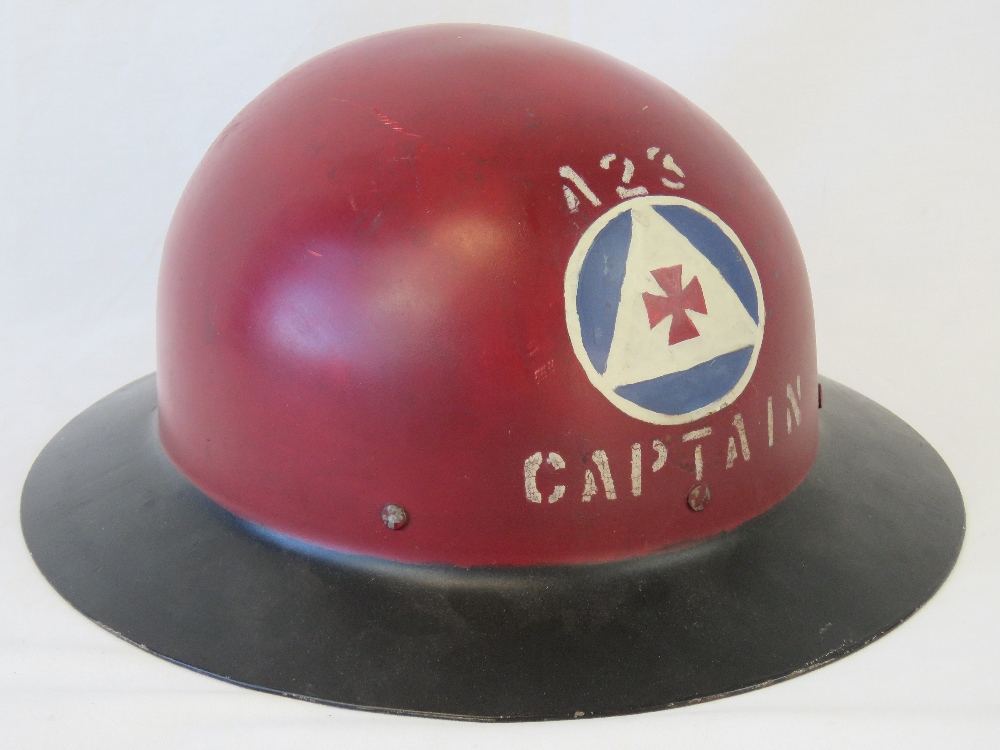 A WWII US Civil Defence Captains helmet complete with liner and chin strap,