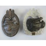 Two reproduction WWII German Panzer badges.