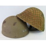 Two reproduction British Military helmets;