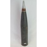 An inert American 120mm High Explosive (HE) Long Range Artillery piece with fuse,