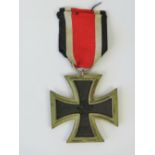 A WWII German Iron Cross medal with original ribbon.