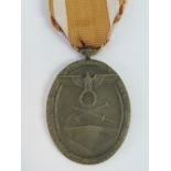 A WWII German West Wall medal with ribbon.