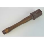 An inert WWII German stick grenade with shrapnel metal head, dated 1939 with maker code,
