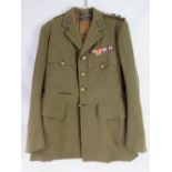 A WWII Royal Artillery Officers tunic with Studd & Millington of London Outfitters label,