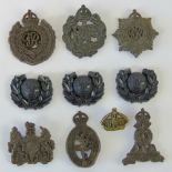 Ten early plastic military badges includ