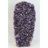 A large heavy and impressive natural amethyst geode measuring 70 x 36cm.