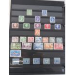 A stock album of World stamps.