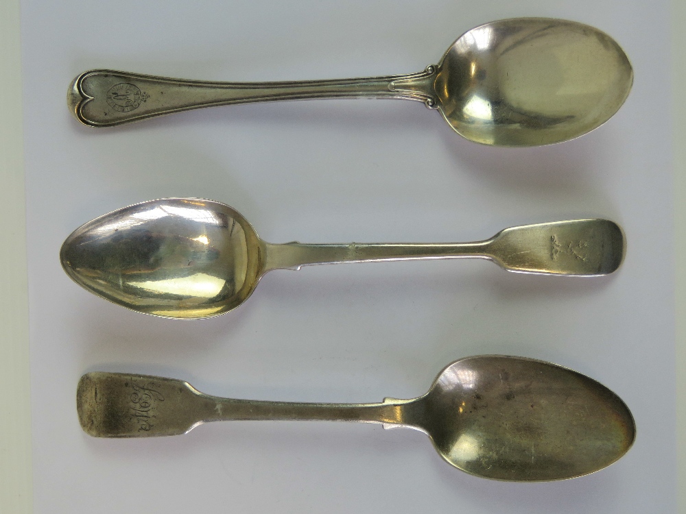 Three HM silver table spoons; one with stag emblem to terminal hallmarked London 1825,